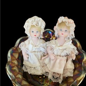 Vintage porcelain dolls with handmade clothing